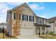 Beautiful two-story brick home with a manicured lawn, and a two-car garage at 7246 Gladstone Cir, Lithonia, GA 30038