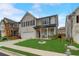 Beautiful two-story brick home with a manicured lawn, and a two-car garage at 7246 Gladstone Cir, Lithonia, GA 30038