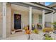 Inviting front porch with autumn decorations, creating a warm and welcoming entrance at 7246 Gladstone Cir, Lithonia, GA 30038