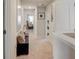 Upstairs hallway with open doorways to bedrooms and office at 7246 Gladstone Cir, Lithonia, GA 30038