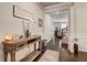 Welcoming foyer featuring hardwood floors, console table, and a view into the living spaces at 7246 Gladstone Cir, Lithonia, GA 30038