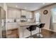 Bright kitchen features granite countertops, stainless steel appliances and an eat-in island at 7246 Gladstone Cir, Lithonia, GA 30038