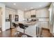 Bright kitchen features granite countertops, stainless steel appliances and an eat-in island at 7246 Gladstone Cir, Lithonia, GA 30038