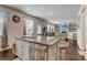 Bright kitchen features granite countertops, stainless steel appliances and an eat-in island at 7246 Gladstone Cir, Lithonia, GA 30038