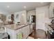 Bright kitchen features granite countertops, stainless steel appliances and an eat-in island at 7246 Gladstone Cir, Lithonia, GA 30038