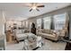 Spacious living room showcasing an open floor plan with hardwood floors and neutral décor at 7246 Gladstone Cir, Lithonia, GA 30038