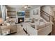 Cozy living room with a fireplace, built-in shelving, and comfortable seating arrangements at 7246 Gladstone Cir, Lithonia, GA 30038