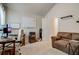 Home office featuring a wooden desk, brown sofa, and bright natural light at 7246 Gladstone Cir, Lithonia, GA 30038