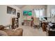 Well-lit home office featuring dual monitors, a comfortable chair, and custom shelving at 7246 Gladstone Cir, Lithonia, GA 30038