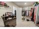 Spacious walk-in closet featuring multiple hanging racks and shelving for optimal storage at 7246 Gladstone Cir, Lithonia, GA 30038
