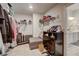 Walk-in closet with shelving, hanging racks, and connection to the home's bathroom at 7246 Gladstone Cir, Lithonia, GA 30038