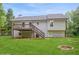 Exterior view of backyard and upper deck with stairway to spacious backyard and fire pit at 75 Willow Bend Nw Dr, Cartersville, GA 30121