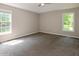 Spacious bedroom with neutral walls and two bright windows at 75 Willow Bend Nw Dr, Cartersville, GA 30121
