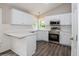Kitchen with quartz countertops, stainless steel appliances, and white cabinets at 75 Willow Bend Nw Dr, Cartersville, GA 30121