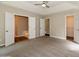 Large main bedroom with ample closet space and a ceiling fan at 75 Willow Bend Nw Dr, Cartersville, GA 30121