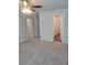 Bedroom featuring neutral carpeting with two doors in the background at 558 Fairview Oak Pl, Dallas, GA 30157