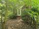 Back porch with steps surrounded by foliage at 1526 Snapfinger Rd, Decatur, GA 30032
