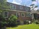 Back of the house shows brick exterior with multiple windows at 1526 Snapfinger Rd, Decatur, GA 30032