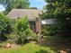 Home exterior with red brick and lots of greenery at 1526 Snapfinger Rd, Decatur, GA 30032