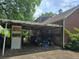 Photo of open garage and carport filled with various items at 1526 Snapfinger Rd, Decatur, GA 30032