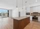 Open-concept kitchen with a large island, stainless steel appliances, and a view of the living area at 675 Drewry Ne St # 205, Atlanta, GA 30306