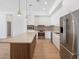 Contemporary kitchen featuring a large island, stainless steel appliances, and ample cabinet space at 675 Drewry Ne St # 205, Atlanta, GA 30306