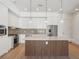 Modern kitchen featuring stainless steel appliances, sleek white cabinets, and a functional island at 675 Drewry Ne St # 205, Atlanta, GA 30306