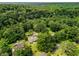 Stunning aerial shot of this home nestled among mature trees, offering privacy and a picturesque setting at 1535 Pathfinder Sw Way, Lilburn, GA 30047