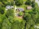 Beautiful aerial view showcases this home with lush surroundings and a spacious lot, creating a private retreat at 1535 Pathfinder Sw Way, Lilburn, GA 30047