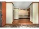 Open foyer featuring stone floors, hardwood floors and decorative molding at 1535 Pathfinder Sw Way, Lilburn, GA 30047