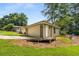 Detached two-car garage with a concrete driveway and well-maintained lawn at 1535 Pathfinder Sw Way, Lilburn, GA 30047