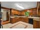 Updated kitchen with wooden cabinets, tile backsplash, and a bright window at 1535 Pathfinder Sw Way, Lilburn, GA 30047