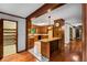 Kitchen with wood cabinets, decorative tile floors, and access to other rooms at 1535 Pathfinder Sw Way, Lilburn, GA 30047