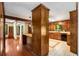 Open kitchen design with wood cabinets, granite countertops, and decorative tile floors at 1535 Pathfinder Sw Way, Lilburn, GA 30047