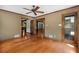 Spacious living room with hardwood floors, multiple entrances, and natural light at 1535 Pathfinder Sw Way, Lilburn, GA 30047