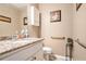 Neutral bathroom features a granite countertop, framed art, and decorative wall features at 2130 Hampton Se Trl, Conyers, GA 30013