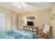 Cozy bedroom featuring a ceiling fan, TV, with neutral colors and a rocking chair at 2130 Hampton Se Trl, Conyers, GA 30013