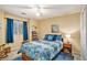 Well-lit bedroom with a ceiling fan, large window, and neutral-colored walls at 2130 Hampton Se Trl, Conyers, GA 30013