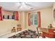 Functional bedroom with a desk, closet storage, and a patterned area rug at 2130 Hampton Se Trl, Conyers, GA 30013