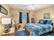 Comfortable bedroom with blue accents, a ceiling fan, and a window with natural light at 2130 Hampton Se Trl, Conyers, GA 30013