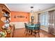 Charming dining room with hardwood floors, elegant lighting, and a cozy table setting, ideal for intimate meals at 2130 Hampton Se Trl, Conyers, GA 30013