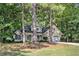 Charming home with a well-manicured lawn and lush greenery, featuring a two-car garage and inviting front porch at 2130 Hampton Se Trl, Conyers, GA 30013