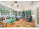 Relaxing sunroom with screened windows overlooking a lush, green backyard at 2130 Hampton Se Trl, Conyers, GA 30013