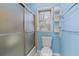 Cozy bathroom featuring a sliding glass shower door and classic fixtures at 4116 River Cliff Chase Se, Marietta, GA 30067