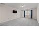 Spacious bedroom with light gray walls, gray carpet, and natural light at 4116 River Cliff Chase Se, Marietta, GA 30067