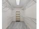 Organized walk-in closet with shelving and gray carpet at 4116 River Cliff Chase Se, Marietta, GA 30067