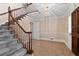 Foyer with staircase, hardwood flooring, and modern lighting, creating a stylish and inviting entrance at 4116 River Cliff Chase Se, Marietta, GA 30067