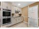 Cozy kitchen with stainless steel oven appliances, neutral cabinets, and convenient access to the dining area at 4116 River Cliff Chase Se, Marietta, GA 30067