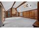 Bright and spacious living room with wood paneling, brick fireplace, and vaulted ceilings at 4116 River Cliff Chase Se, Marietta, GA 30067
