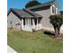 Charming home showcasing its architectural details, tidy yard, and welcoming front porch at 2315 Oakland Spring Dr, Snellville, GA 30039